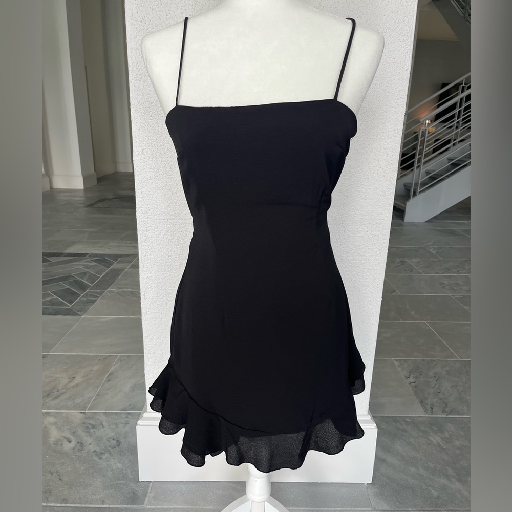 lucy in the sky black mini dress with bow ties in the back